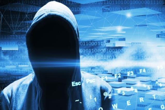 Illustrative image of a computer hacker (photo credit: INGIMAGE)