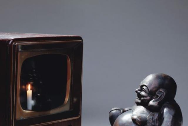 ‘Smiling Buddha (Buddha Looking at Old Candle TV),’ 1992, by Korean-American artist Nam June Paik (photo credit: Courtesy)