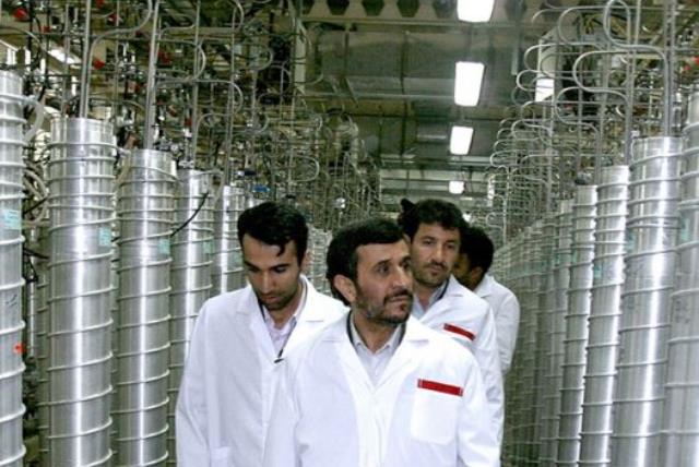 Iranian President Mahmoud Ahmadinejad (C) visits the Natanz nuclear enrichment facility, 350 km (217 miles) south of Tehran, April 8, 2008 (photo credit: REUTERS)