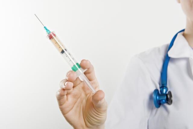 Vaccine syringe (photo credit: INGIMAGE)